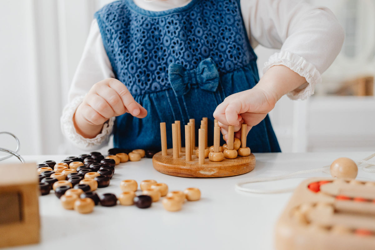 <p>Helping little ones <em>thrive</em> <br/>at bedtime, mealtimes <br/>and through play.</p>